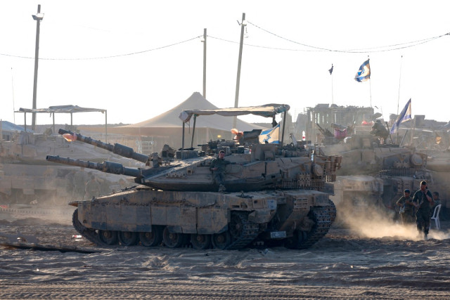 Israeli troops man a position near the border with the Gaza Strip on July 21, 2025